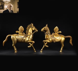 A pair of Chinese Ming Dynasty Tibetan gilt bronze horses