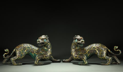 A pair of auspicious beasts inlaid with gold, silver and gemstones from the Warring States Period of