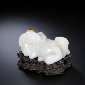 A Chinese Qing Dynasty Hetian white jade carving of three sheep