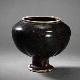 Chinese Tang Dynasty Gongxian kiln black glaze high-footed melon-shaped jar