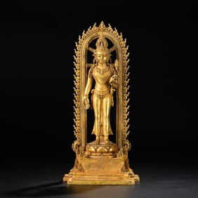 A West Asian Gilt-Bronze Standing Buddha