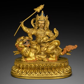 A Chinese gilt bronze statue of the Heavenly King of Wealth, Yongle period of the Ming Dynasty