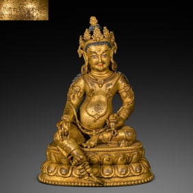 A Chinese Ming Dynasty gilded bronze statue of the God of Wealth