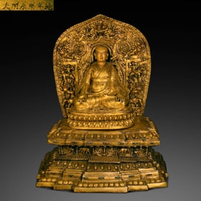 A Chinese Gilt-Bronze Seated Tibetan Guru Buddha from the Yongle Period of the Ming Dynasty