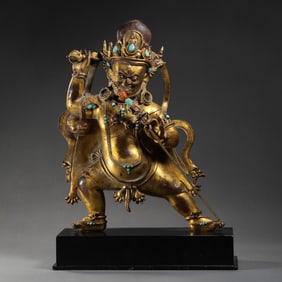 A Chinese Ming Dynasty Gilt Bronze and Gem-Inlaid Standing Buddha