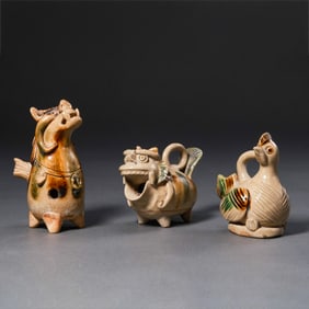 A group of Chinese Tang Dynasty Changsha kiln dot-painted animal ornaments