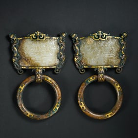 A pair of gold, silver and jade door knockers from the Warring States Period of China