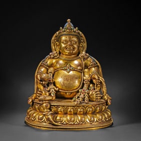A Chinese Ming Dynasty gilded bronze statue of the God of Wealth