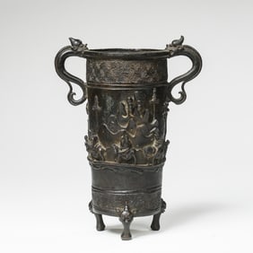 Ancient Chinese three-legged copper cup with two handles