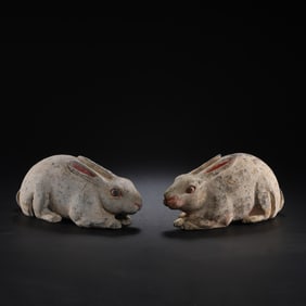 A pair of Chinese Han Dynasty painted pottery rabbits