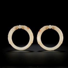 A pair of Chinese bracelets with double dragons and pearls
