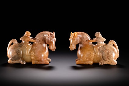 A pair of jade horse-mounted figures from the Han Dynasty in China