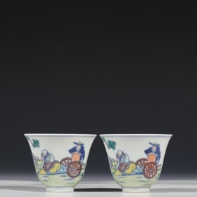 A pair of cups with story designs from the Qing Dynasty