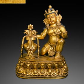 A Chinese gilt bronze statue of a seated Buddha from the Qianlong period of the Qing Dynasty