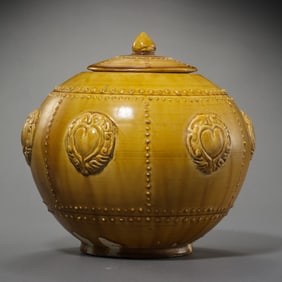 Chinese Sui Dynasty yellow glaze plastic drum lid jar