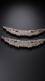 A pair of Chinese Han Dynasty jade pendants