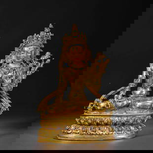 A Chinese Qing Dynasty gilt bronze statue of a seated Buddha: H. 20.5 cm. W. 13.5 cm. Weight. 1705 gram.