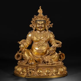 A Chinese Ming Dynasty gilded bronze statue of the God of Wealth