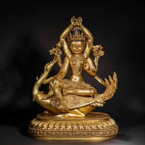 A Chinese Ming Dynasty gilt bronze statue of a seated Buddha