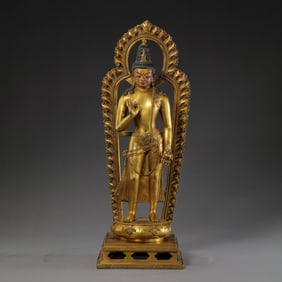 A Chinese Qing Dynasty gilt bronze standing Buddha statue