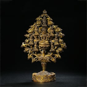A Chinese Ming Dynasty gilt bronze statue of a seated Buddha