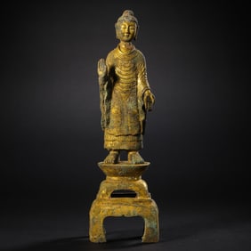 A standing gilt bronze Buddha statue from the Northern Wei Dynasty, China