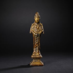 A Chinese Liao Dynasty gilt-bronze standing Buddha statue