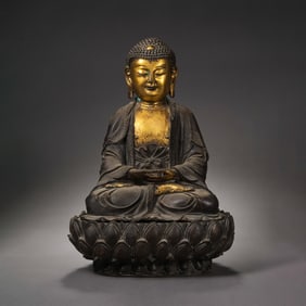 A Chinese Ming Dynasty gilt-bronze statue of seated Sakyamuni Buddha