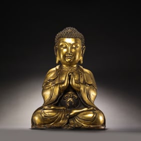 A Chinese gilt bronze statue of a seated Buddha from the Xuande period of the Ming Dynasty