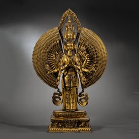 A Chinese Qing Dynasty gilt bronze standing Buddha statue