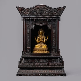A Chinese Ming Dynasty gilt bronze statue of a seated Buddha