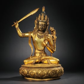 A Chinese Qing Dynasty gilt bronze Mongolian Buddha statue
