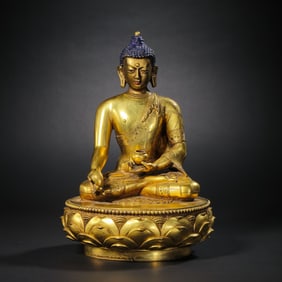 A Chinese Qing Dynasty gilt bronze Mongolian Buddha statue