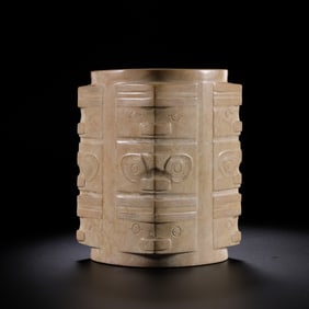 A white jade cong with chicken bone and animal face pattern from the Liangzhu culture of the