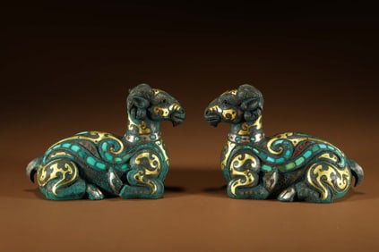 A pair of Chinese Warring States Period gold, silver and turquoise inlaid sheep weights