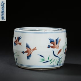 A Chinese cricket jar with flower and bird patterns from the Xuande period of the Ming Dynasty