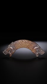 A jade pendant with two dragon heads from the Warring States Period, China