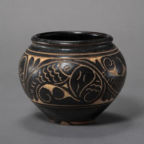 Black-glazed jar with carved fish and algae patterns from the Cizhou kiln of the Northern Song