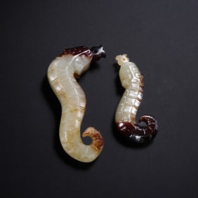 A pair of white jade mother and child snakes from the Han Dynasty