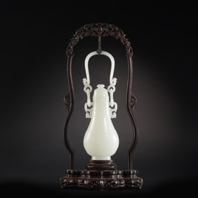 Chinese Qing Dynasty Hetian white jade bottle with handle and lid