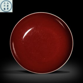 A red-glazed plate from the Yongzheng period of the Qing Dynasty, China