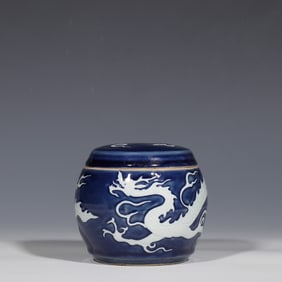A Chinese Yuan Dynasty blue-glazed jar with a white dragon pattern