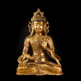 A Chinese Ming Dynasty gilt bronze statue of a seated Buddha