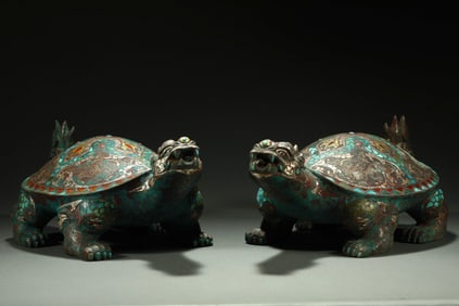 A pair of Chinese Warring States-era gold, silver, and turquoise-inlaid turtles