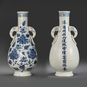 A pair of blue and white vases with floral designs and double elephant ring ears from the Yuan