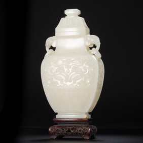 Chinese Qing Dynasty Hetian white jade vase with animal mask design and double ring handles
