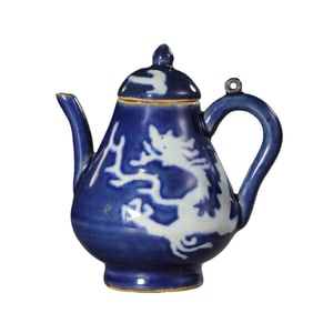 Chinese Yuan Dynasty celadon-glazed ewer with white dragon design