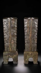 A pair of Chinese Han Dynasty jade cong with animal mask patterns