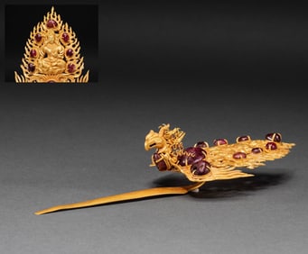 A pure gold phoenix hairpin inlaid with gemstones from the Liao Dynasty in China