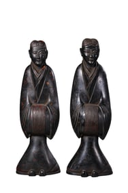 A pair of Chinese Han Dynasty wooden painted figures